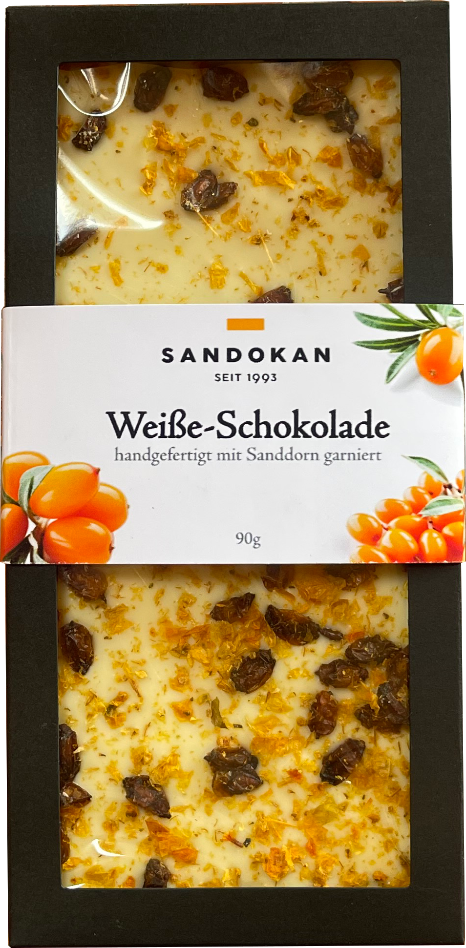 Weiße Schokolade mit Sanddorn in schwarzer Verpackung